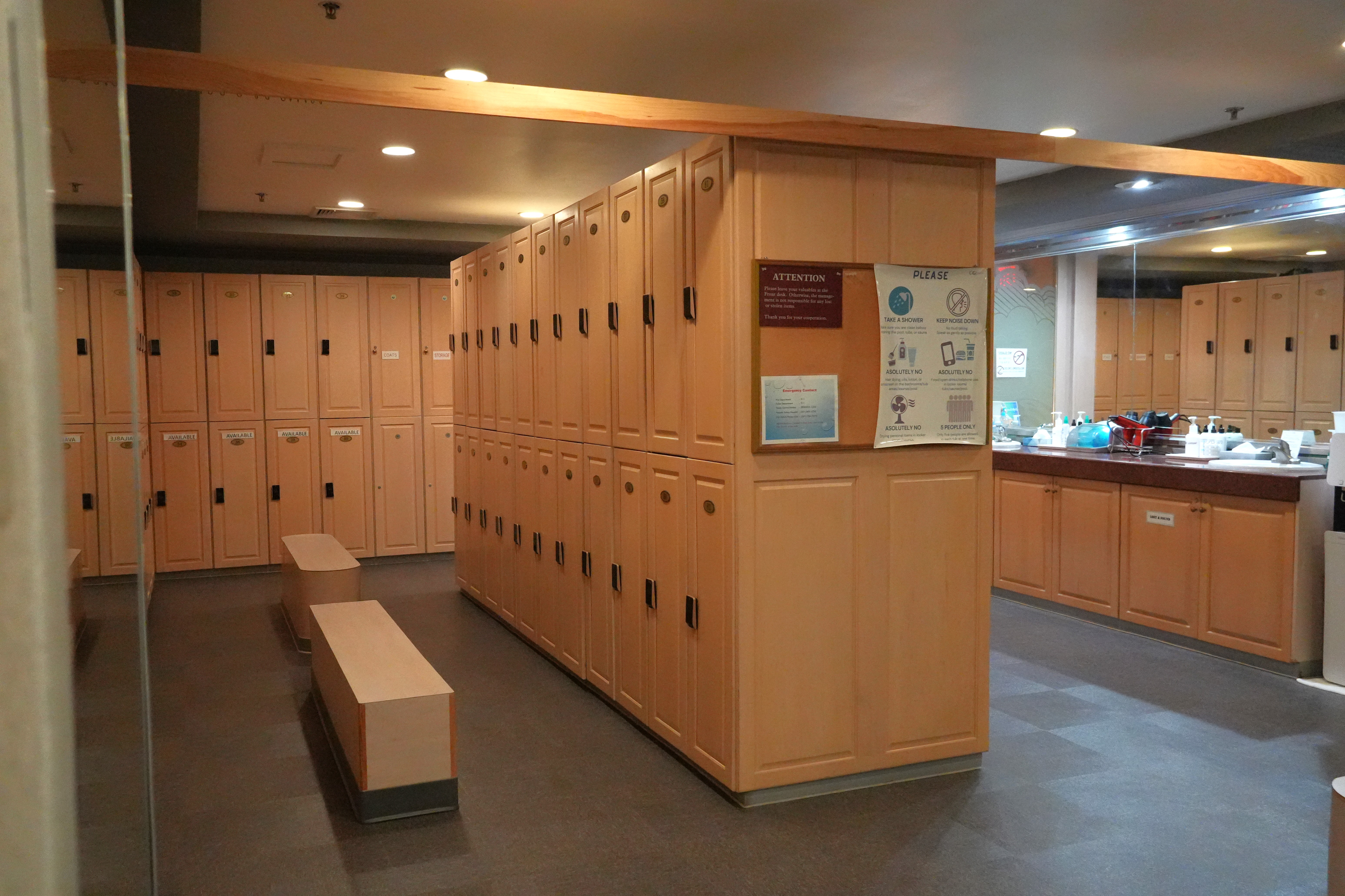 Resort-style locker rooms with robes, towels, and amenities